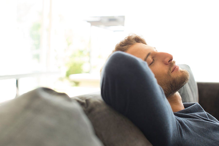 Man relaxing on sofa