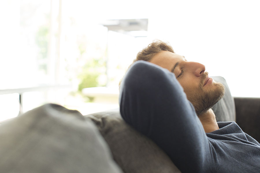 Man relaxing on sofa
